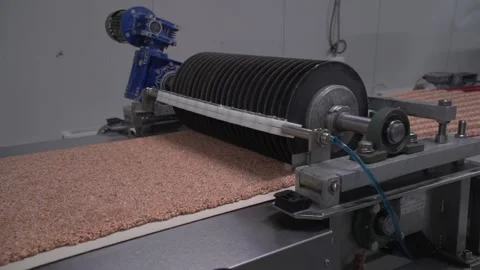 Close up of cylindrical cutter cutting nut material on nut bar making machine Stock Footage 163713703