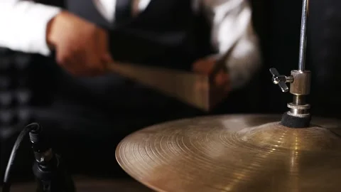 Close-up of a cymbal drum set on which a drummer is playing Stock Footage 149428324
