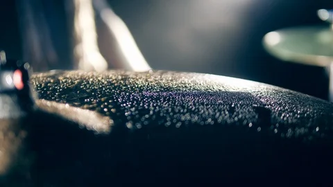 Close up of a cymbal getting hit and splashes of water Stock Footage 125125783