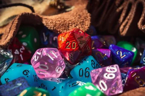 Close-up of a d20 on a pile of dice Stock Photos