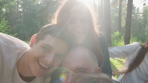 Close Up Of Dad Lying On Mat Surrounded By Family Outdoors Video stock 321544874