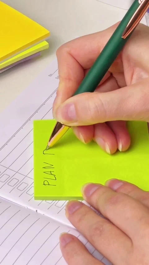 A close-up of a daily planner on a sticky note Stock Footage 337213891
