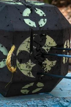 A close-up of a damaged archery target with arrows embedded in it Stock Photos