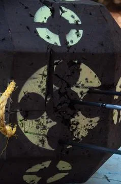 A close-up of a damaged archery target with arrows embedded in it Stock Photos