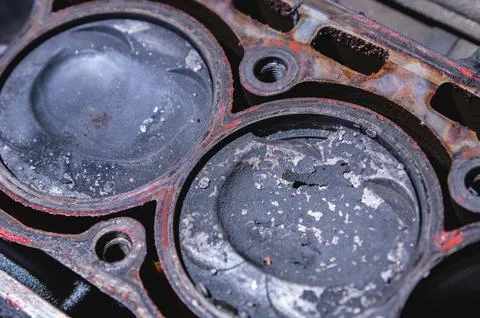 Close-up of a damaged piston of an internal combustion engine with carbon Stock Photos