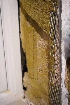 Close up of a damaged plaster wall in a house 写真素材