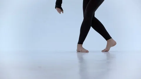 Close up of a dancer's feet as she practices point exercises, slow motion. Stock Footage 103455735