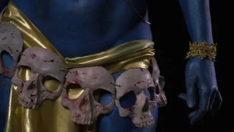 Close up of dancing Kali wearing ancient golden clothes with skull on the belt Stock Footage 138003852