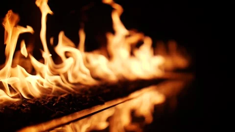 Close up on the dancing orange flames of a fire in a hearth Stock Footage 150673641