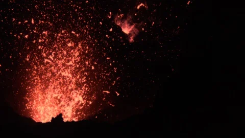 CLOSE UP: Dangerous active volcano in Sicily erupting and exploding at night. Stock Footage 103254099