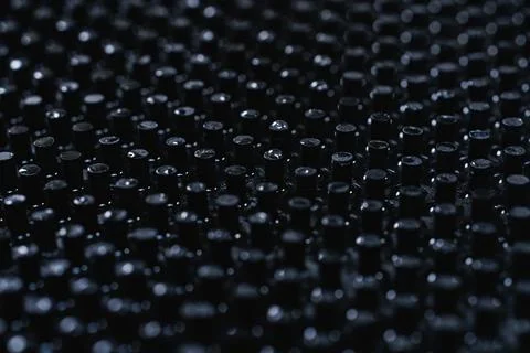 Close up of dark black peg repeating pattern Stock Photos