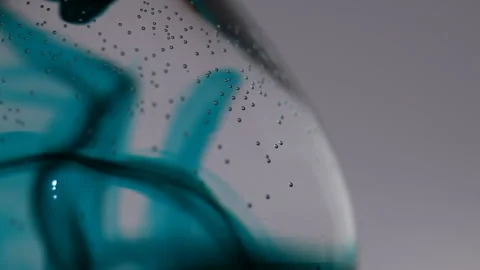 Close up of dark blue liquid going down throughout water Stock Footage 231488110