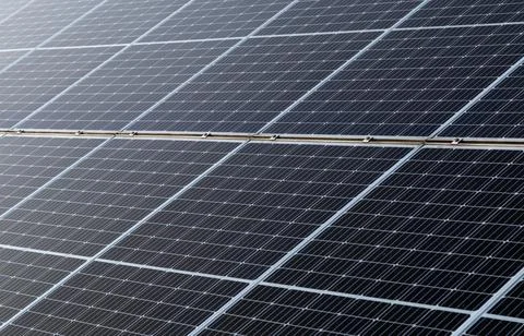 Close-up of dark blue solar panel, abstract solar panels background. Stock Photos