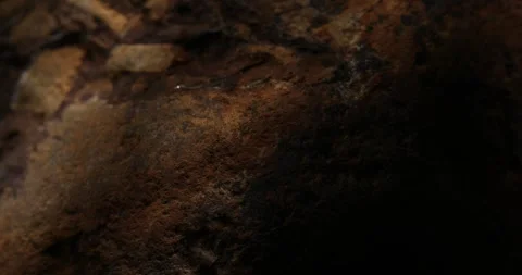 Close-up of Dark Brown Rock Surface with Natural Textures Stock Footage 289723488