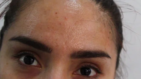 Close up of dark eyes looking in different directions and different blink rates Video stock 126945403