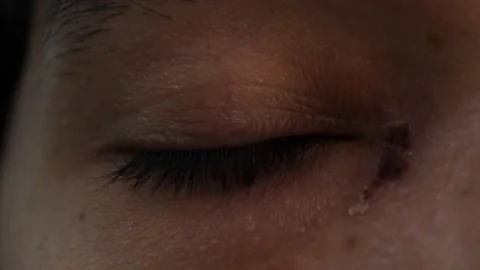 Close up of dark eyes looking in different directions and different blink rates 動画素材 126946483