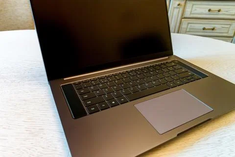 Close up of dark gray computer touchpad witk black keyboard 스톡 사진