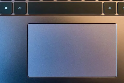 Close up of dark gray computer touchpad witk black keyboard Foto stock
