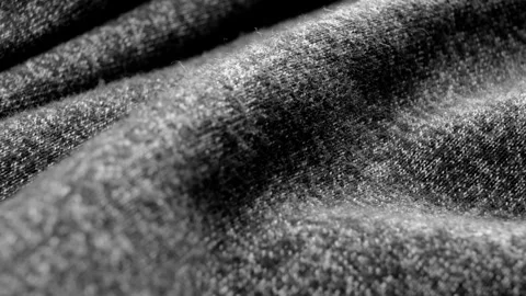 Close-up of dark gray cotton fabric. Dolly slide shot. Stock Footage 254132126