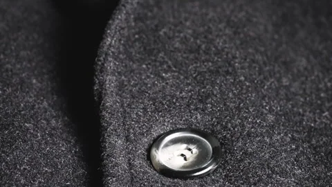 Close-up of a dark grey wool coat lapel  Stock Footage 346656694