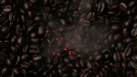Close-up of dark roasted coffee beans. Smoke rises from the coffee beans Stock Footage 263065072