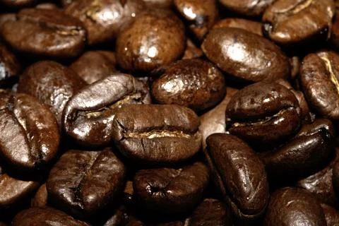 Close up of dark roasted coffee beans deep brown and tasty close up Stock Photos