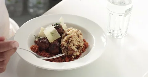 Close up of dark skinned man eating dinner Stock Footage 80553746