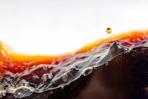 Close-up of dark soda splash with bubbles and liquid motion Stock Photos