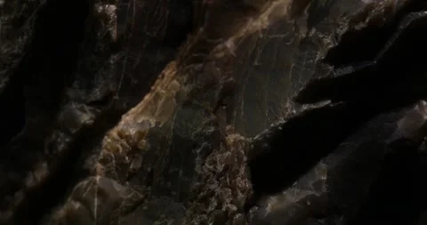 Close-Up of Dark Stone Layers with Natural Rough Texture Stock Footage 296160220