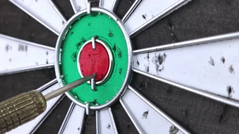 Close-up of the dart hitting the center of the target. Macro video filming. The  Stock Footage 147716720