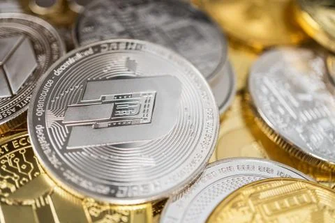 Close-up of dash physical coin on stack of many other cryptocurrencies Stock Photos