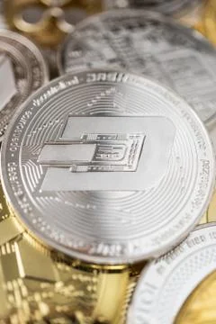 Close-up of dash physical coin on stack of many other cryptocurrencies Stock Photos
