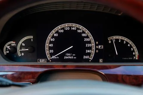 Close-up of a dashboard with elements of a tree in a car's design with a tach Foto stock