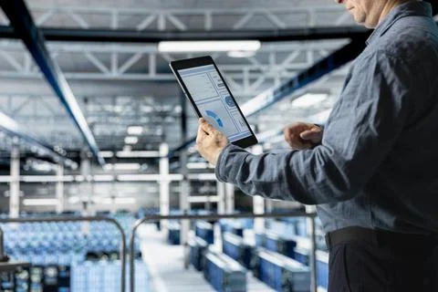 Close up of data center admin checking infrastructure diagnostics on tablet Stock Photos