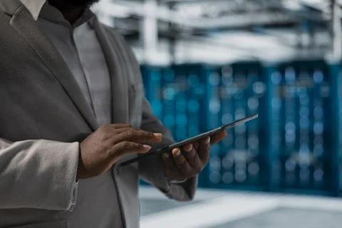 Close up of data center admin using tablet to protect servers Stock Photos