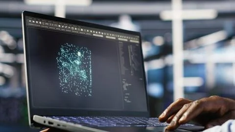 Close up of data center admin using machine learning algorithms on laptop 스톡 사진