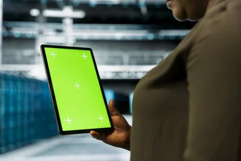 Close up of data center admin using green screen laptop to install equipment Foto stock