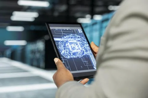 Close up of data center admin using artificial intelligence on tablet Stock Photos