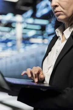 Close up of data center admin using laptop, managing server virtualization 스톡 사진