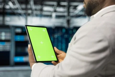 Close up of data center computer scientist using isolated screen tablet 写真素材