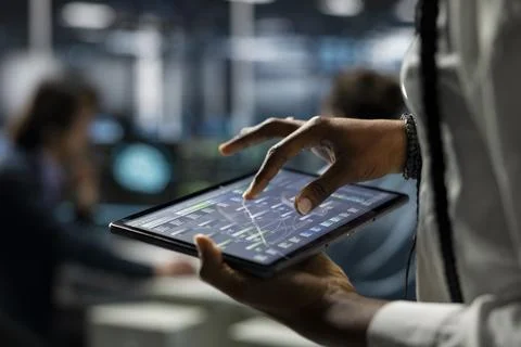 Close up of data center computer scientist using tablet, deploying servers Stock-Fotos