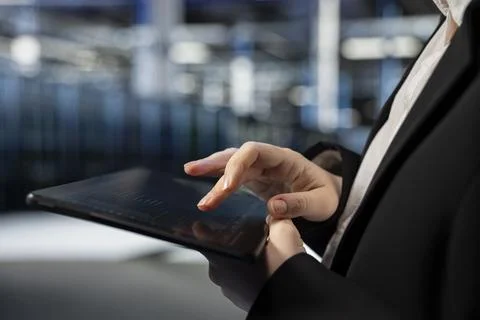 Close up of data center computer scientist typing on tablet Foto stock