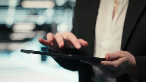 Close up of data center cybersecurity analyst using tablet to conduct audit Stock Footage 329329084