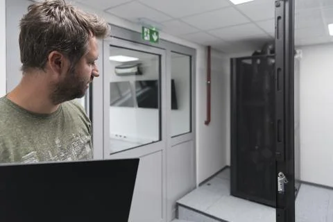 Close up on Data Center Engineer hands Using keyboard on a supercomputer Server 스톡 사진
