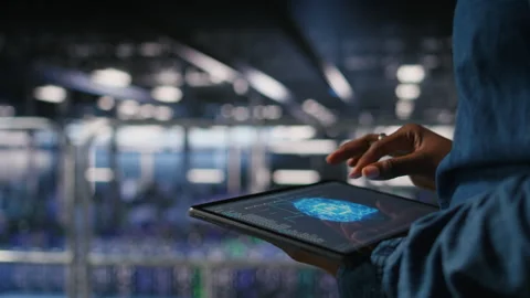 Close up of data center engineer using tablet, doing maintenance on AI rigs Stock Footage 310785040
