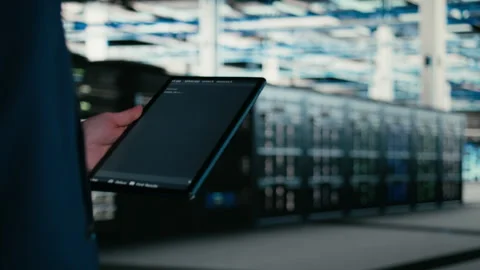 Close up of data center engineer using tablet to write code Stock Footage 329532678