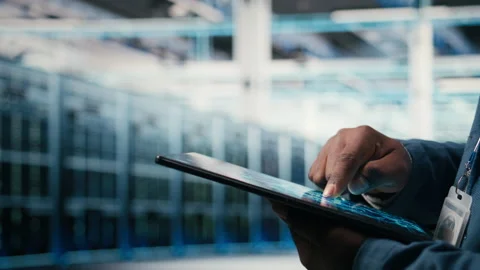 Close up of data center engineer using AI software on tablet Stock Footage 330139725