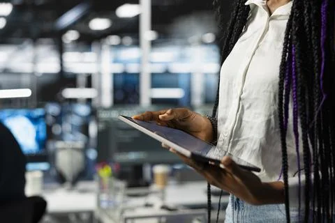 Close up of data center engineer using tablet, deploying servers 스톡 사진