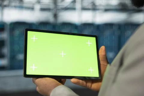 Close up of data center engineer using green screen tablet in data center Stock Photos
