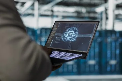 Close up of data center engineer using artificial intelligence on laptop Stock Photos